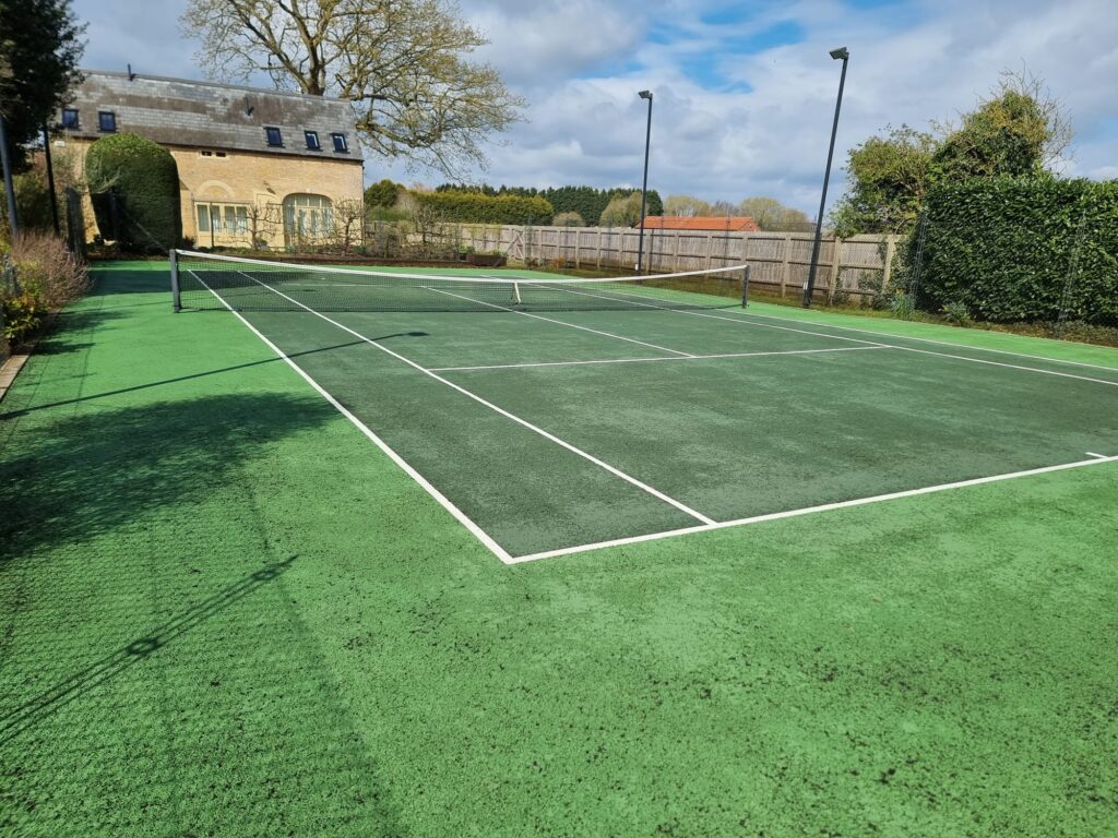 tennis court after it has been deep cleaned and moss treated
